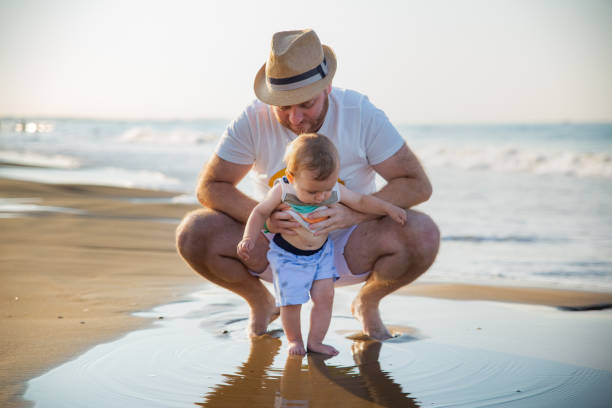 istock Father and son at the beach 1277406193