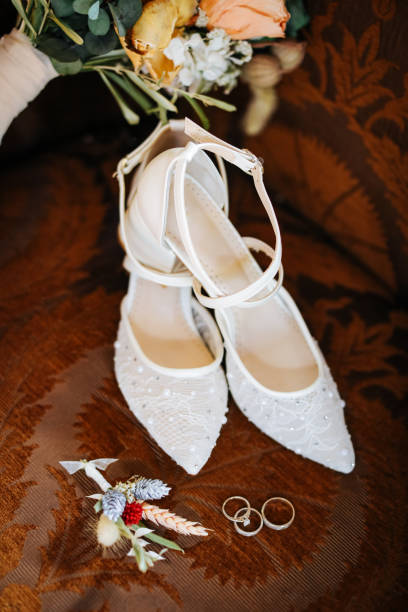 istock Rustic wedding bouquet and bridal shoes 1277406330