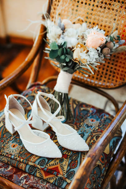 istock Rustic wedding bouquet and bridal shoes 1277406574
