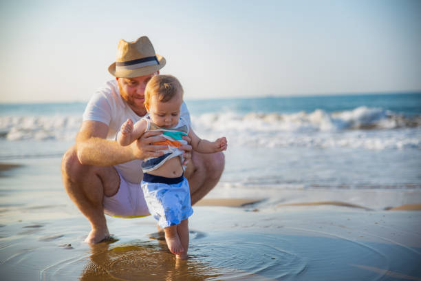 istock Father and son at the beach 1277407810