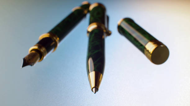 istock Ballpoint pen and fountain pen on glass table 1277408088
