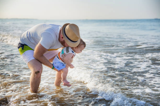 istock Father and son at the beach 1277409535