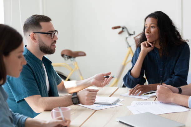 istock Confident mentor coach training diverse employees at corporate meeting 1277410326