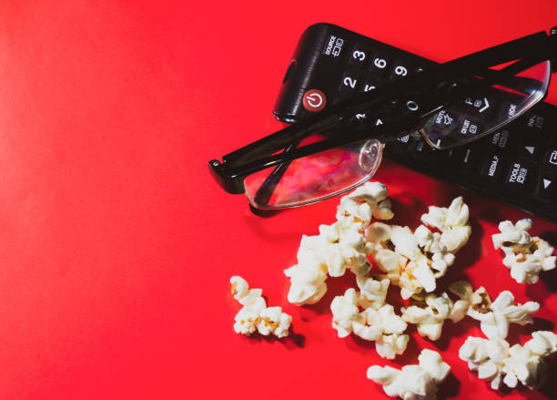 istock TV remote control popcorn and glasses 1277410429