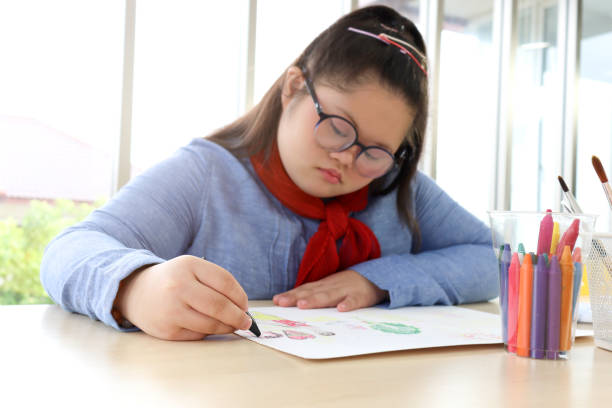 istock Disabled kids classroom, children having fun during study at school, kids learning together, schoolgirl concentrate painting her hands in art classroom 1277410461
