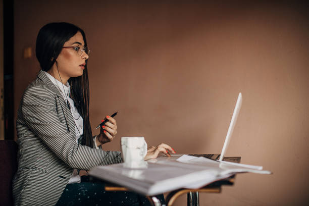 istock Young woman doing a video call on laptop 1277411118