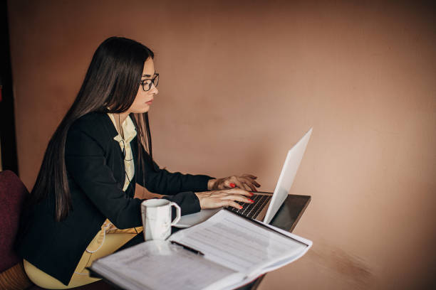 istock Woman doing a video call on laptop at home 1277411200