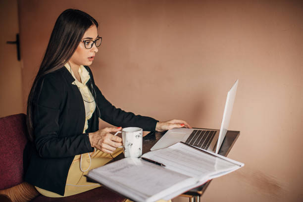 istock One young woman doing a video call on laptop at home 1277411245