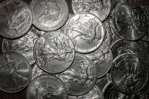 One troy ounce of Fine Silver. American Currency of one dollar.