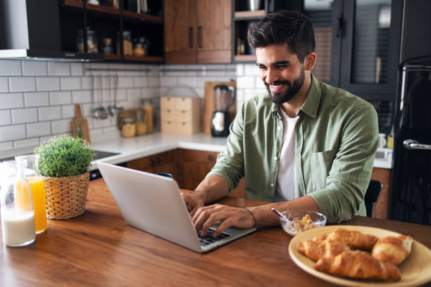 Bearded young caucasian working from home