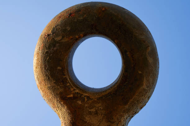 Rusty clutch ring of a drawbar. Isolated on blue.