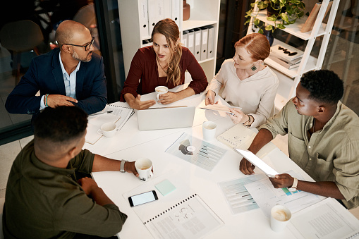 Shot of a group of businesspeople having a meeting in a modern office