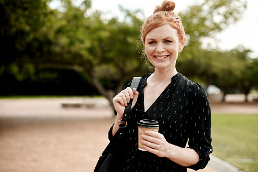 Portrait of a confident businesswoman enjoying a coffee break in the city