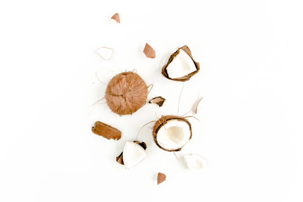 istock cracked coconut on white background. flat lat, top view 1277415469