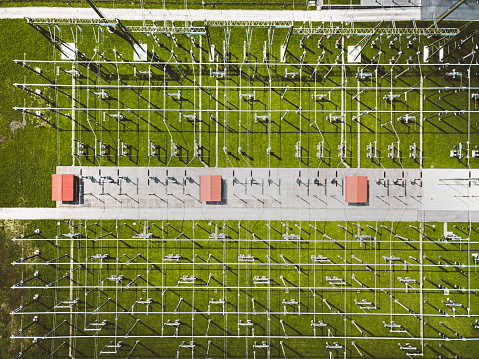 Aerial view of electrical power substation. Top down view of electrical substation grid. Substation in the countryside.