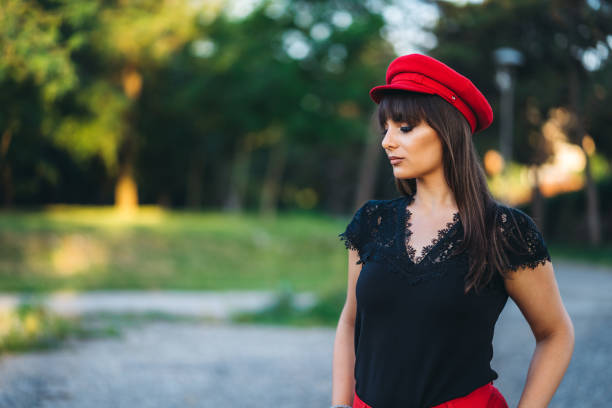 istock Pretty woman posing in public park 1277418439