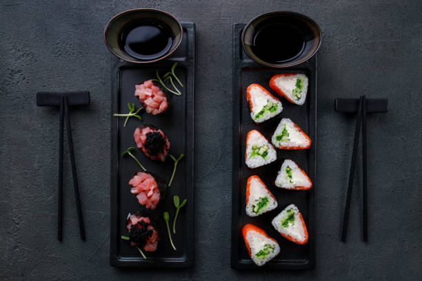 istock Seafood delicatessen sushi rolls set on plates 1277418472