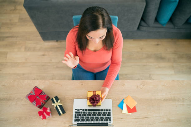 istock Woman holding a red gift box 1277419262