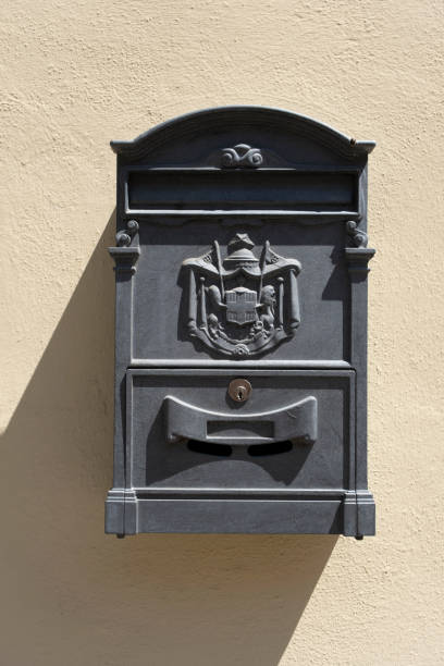 istock Old red Italian mail box on a wall in italy 1277420624