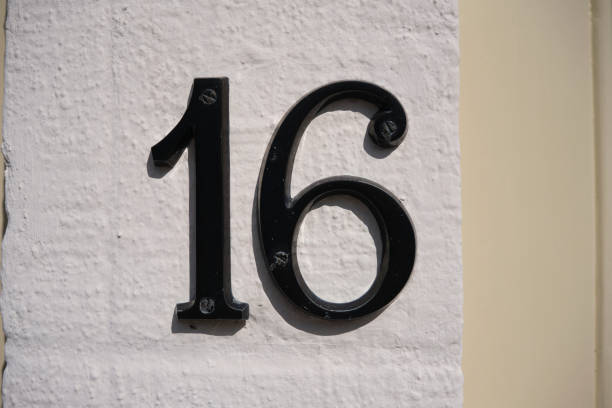 istock House Number 16 sign on wall 1277420703