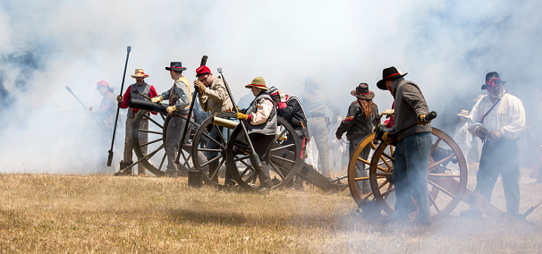 Fredonia, Wisconsin, USA, August 31, 2013: At the annual Pioneer Village Revolutionary War encampment, reenactors portraying Continental line forces consisting of 3rd New York Regiment and militia, retreat from the crown forces, after taking too many casualties.