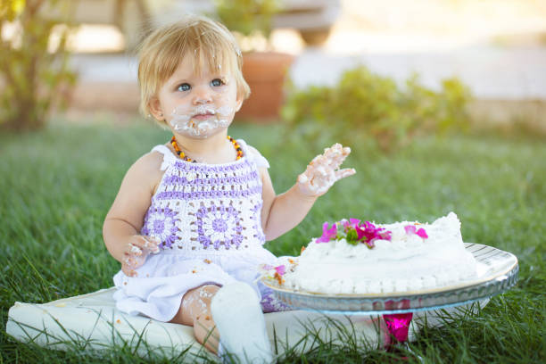 istock first age celebration. birthday cake and cute baby 1277425439