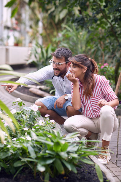 istock Young couple observing beautiful plants 1277425471