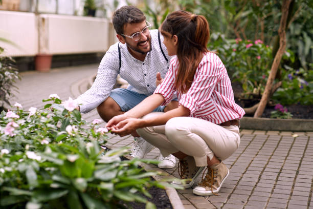 istock Young couple enjoying beautiful flowers 1277425784