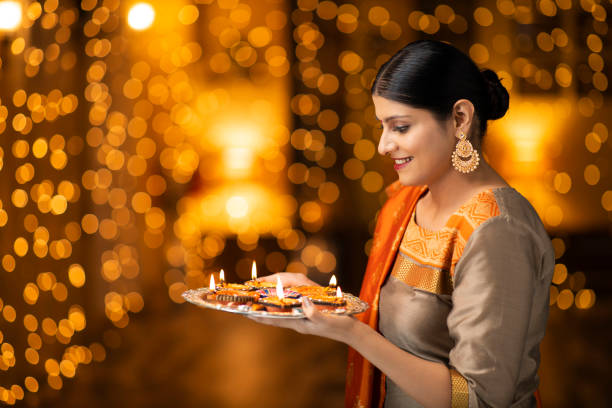 istock young women celebrate diwali 1277426638