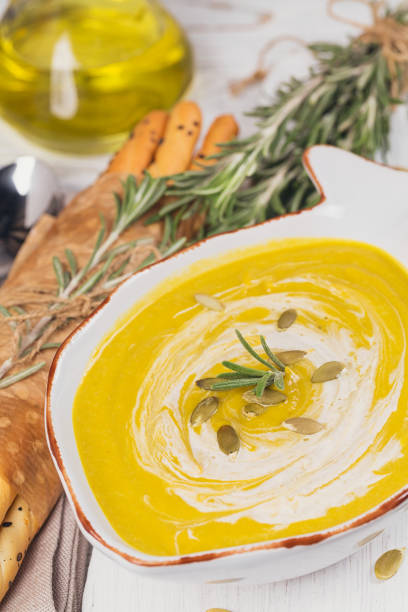 istock Pumpkin soup with cream and pumpkin seeds 1277426668