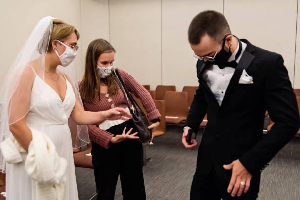 istock Newlyweds putting back protective face mask after ceremonie. 1277432173