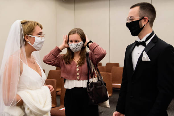 istock Newlyweds putting back protective face mask after ceremonie. 1277432209
