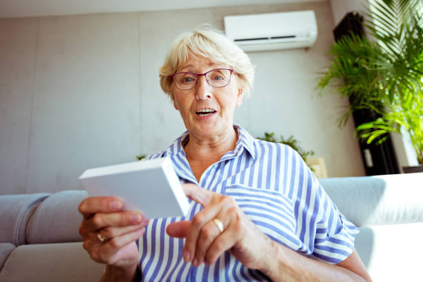 istock Senior lady during video call 1277434857