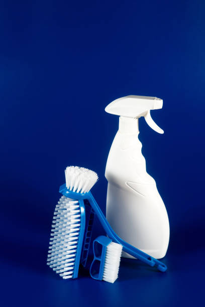 istock white bottle with reading fluid for glasses and brushes on a blue background, place for text 1277441740