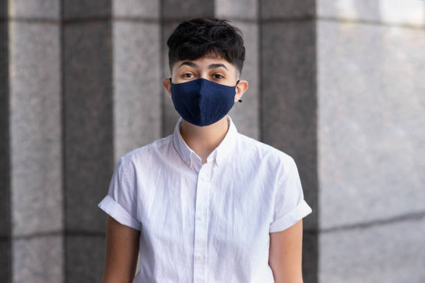 istock Woman is Smiling While Wearing a Mask 1277444053