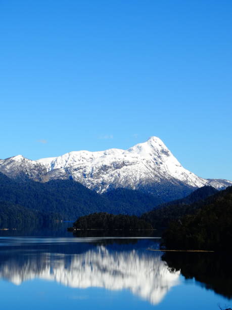 istock Snowy mountains reflected in the water 1277451879