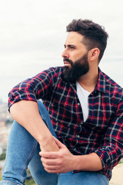 istock vertical portrait of a handsome bearded man 1277453469