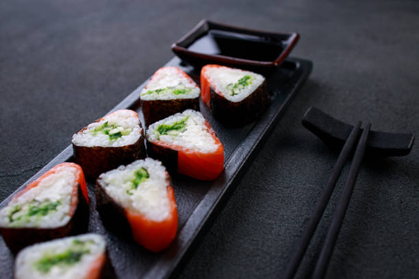 istock Seafood delicatessen salmon sushi rolls on plate 1277458489