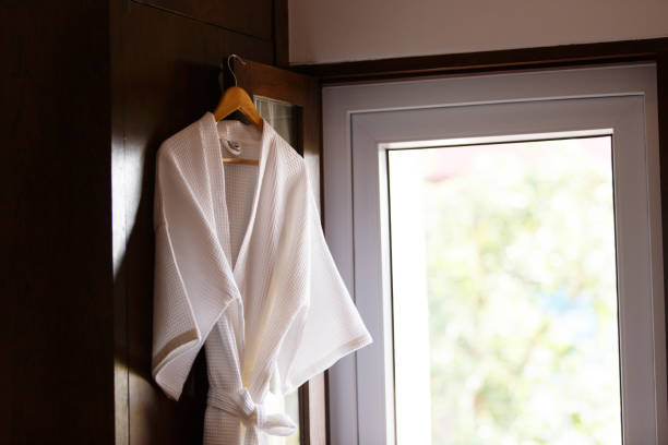 istock Bathrobe hanging near the glass window 1277462911