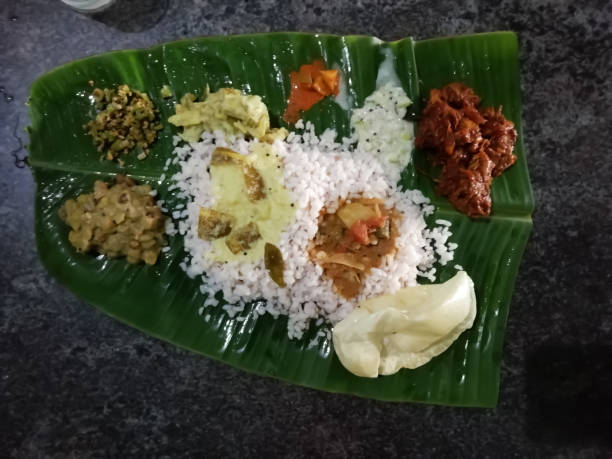 istock delicious Kerala style dish in a banana leaf isolated on a surface 1277462951