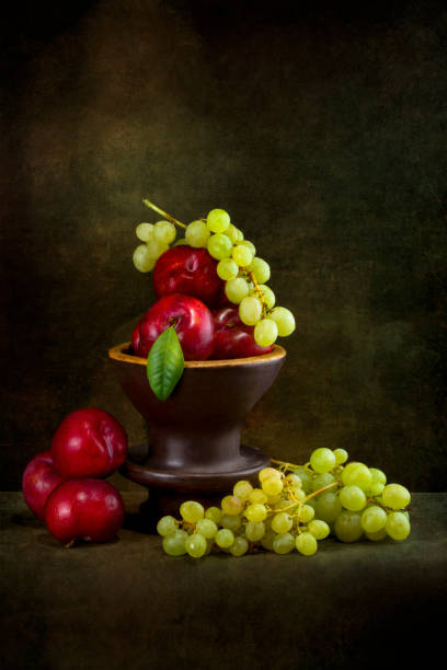 istock Still life with ripe grapes and plums 1277468127