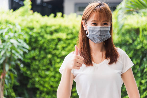 istock woman wearing face mask protective outdoor 1277468205