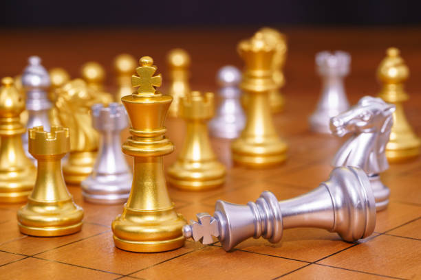 istock Gold king chess piece stand on wood chessboard 1277471191