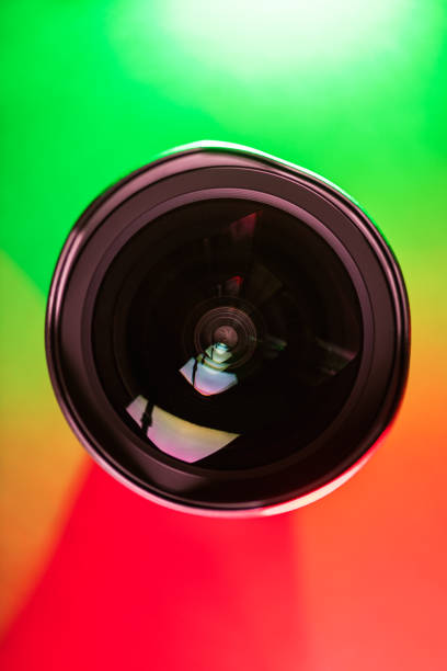 istock The camera lens and the beautiful multi-colored gradient color. Optics. Vertical photo 1277475866