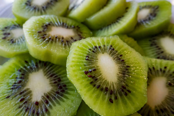 istock close up sliced kiwi fruits on white plate 1277477819