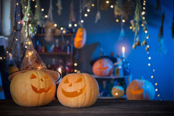 istock Halloween pumpkins on old wooden table on background Halloween decorations 1277478665