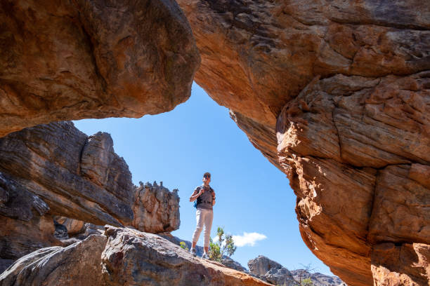 istock Woman admiring the view over the mountains 1277479061