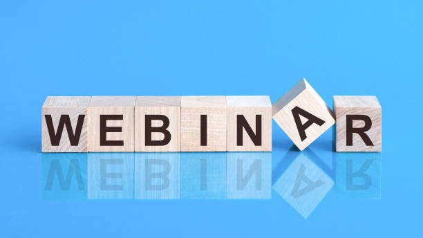 istock Webinar word wooden cubes on a blue background 1277481564