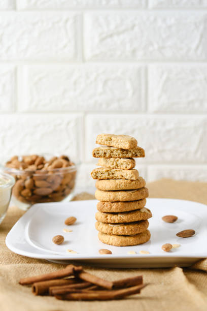 istock Stack of Gluten Free Almond Cookies set on white cafe table background. 1277481611