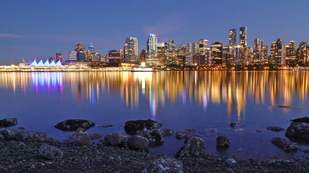istock Night skyline with reflection of Vancouver Downtown as seen from Stanley Park, British Columbia, Canada 1277481830